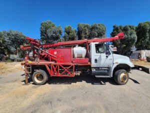 An image of one of Rig Source's drill rigs mounted on a truck.