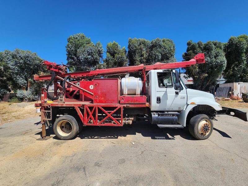 An image of one of Rig Source's drill rigs mounted on a truck.